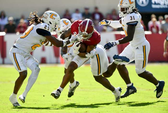 Nov 18, 2023; Tuscaloosa, Alabama, USA; A trio of Chattanooga Mocs defenders including Chattanooga Mocs defensive back Telly Plummer (29) and Chattanooga Mocs linebacker Bo Spearman (31) close to tackle Alabama Crimson Tide running back Jase McClellan (2) at Bryant-Denny Stadium. Mandatory Credit: Gary Cosby Jr.-USA TODAY Sports